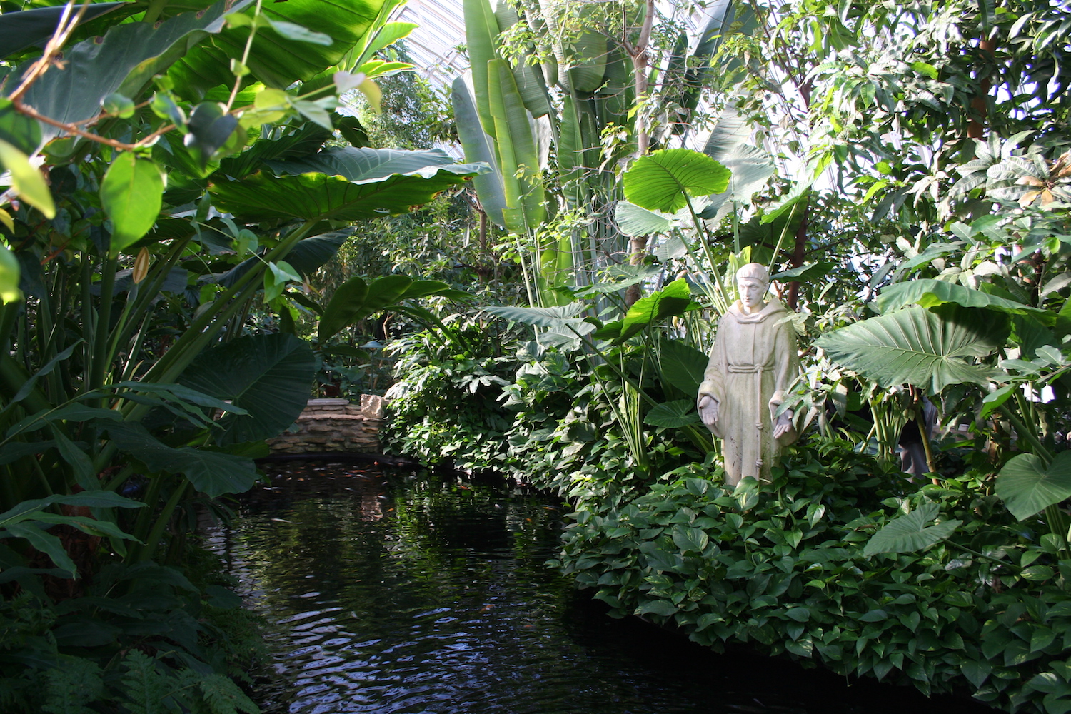 green pond with statue